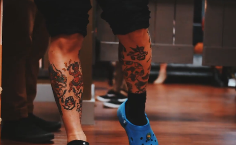 Tattoo artist cleaning a chair.