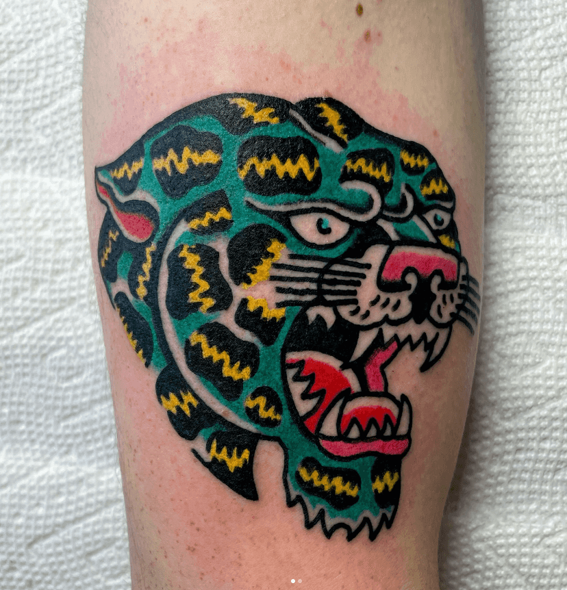Neon colored tattoo of a cheetah.